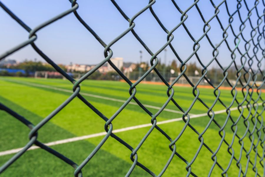 chainlink fencing on a football field