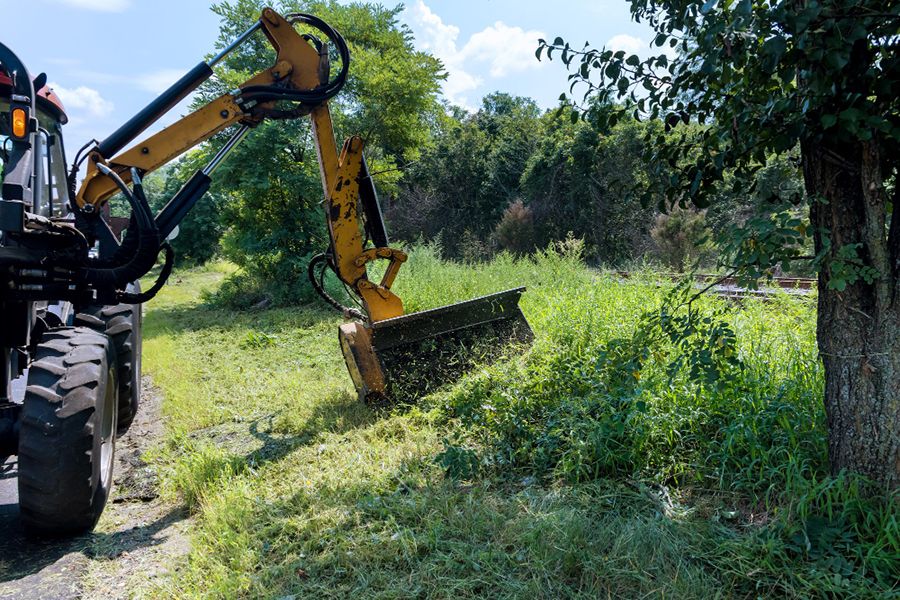 Flail mower cutting grase on roadside