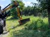 Flail mower cutting grase on roadside